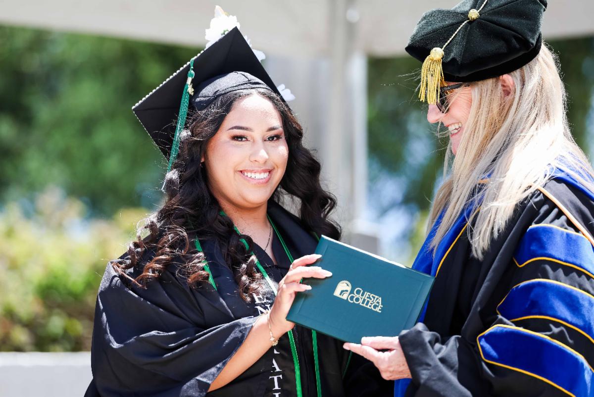 Commencement president with graduating student