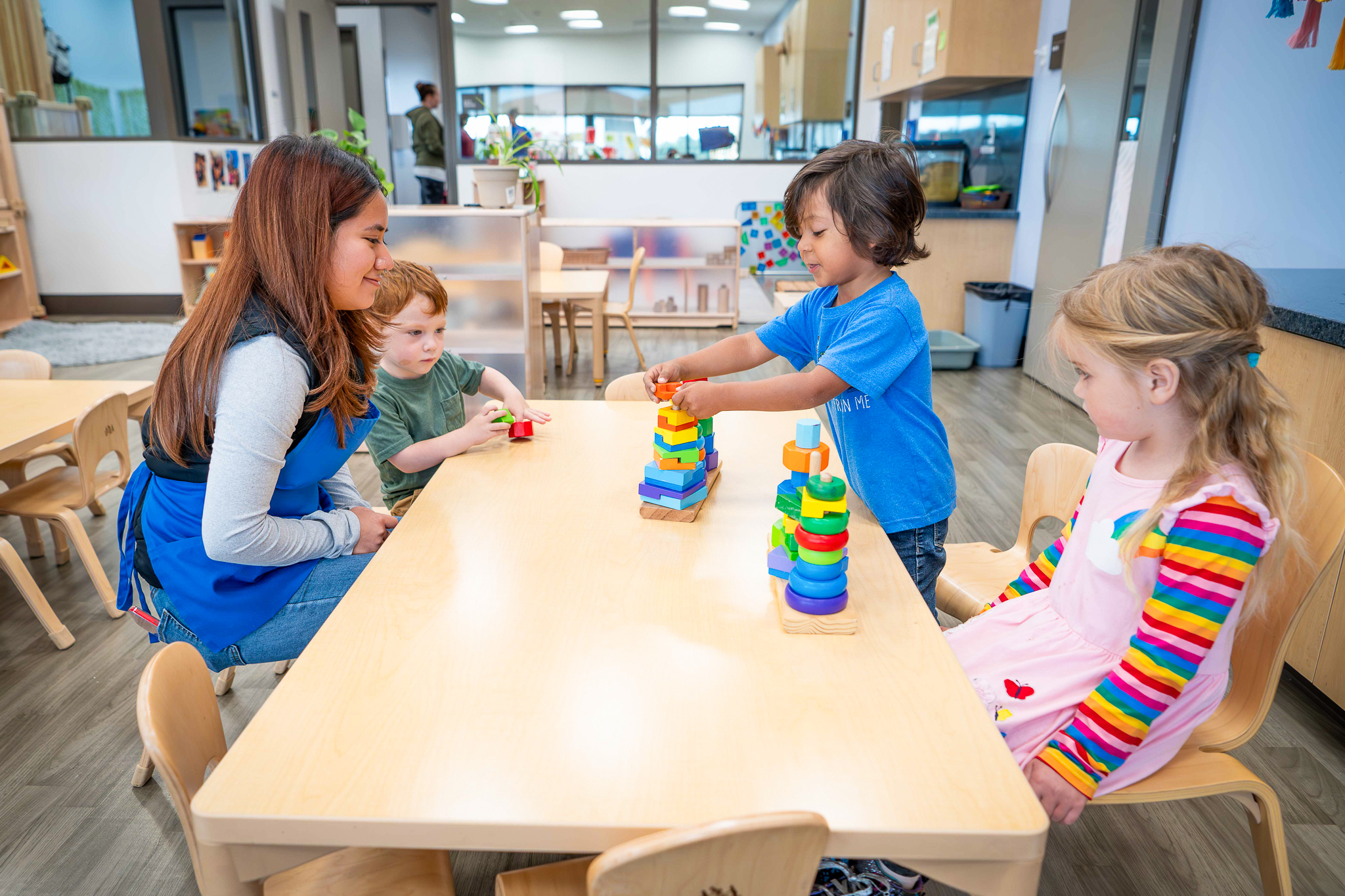 A student educator with young learners at the North County Campus Children's Center.