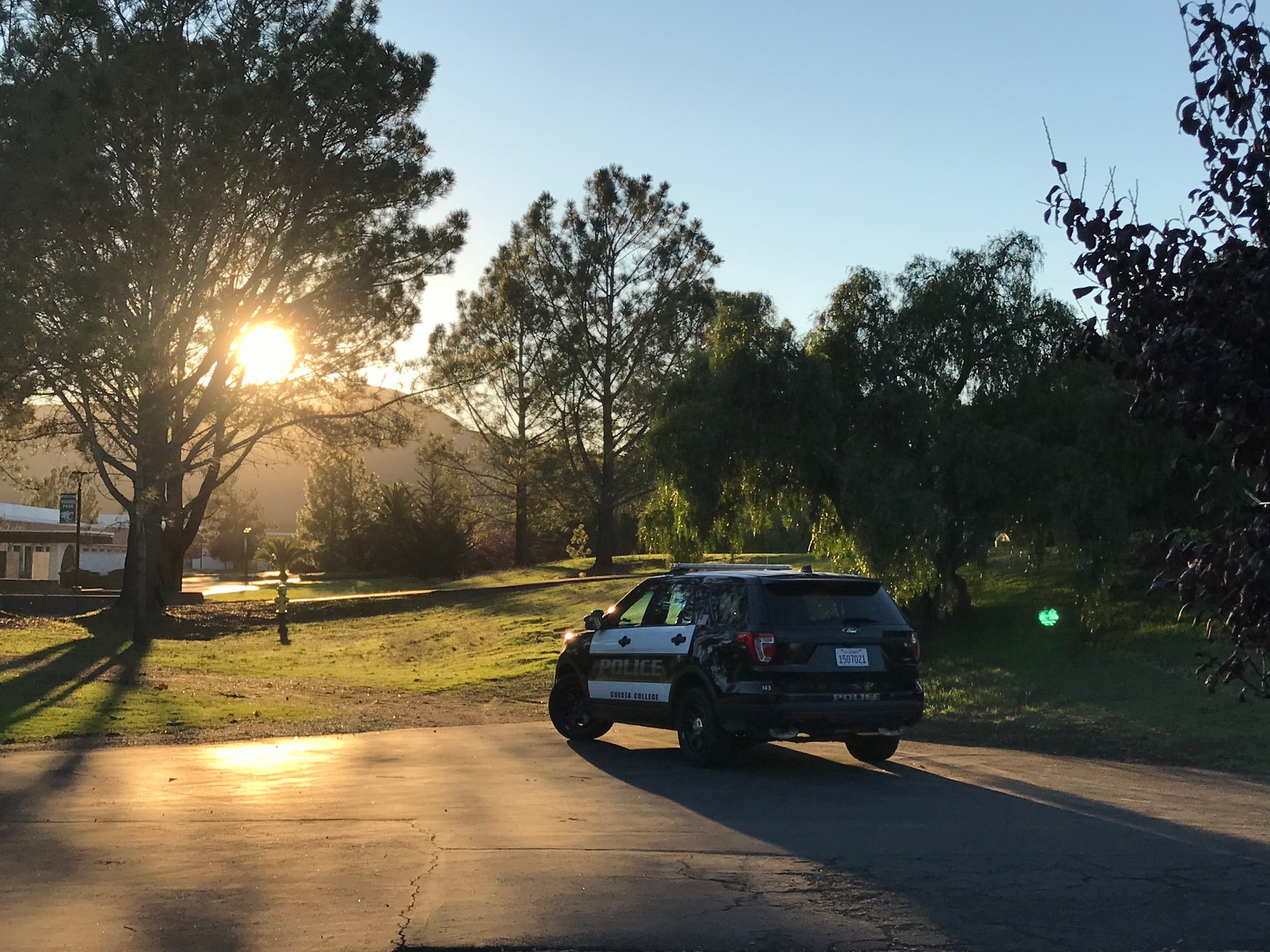 Campus Police vehicle with sunset