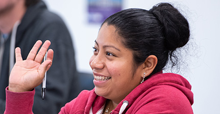 Hospitality student raising hand