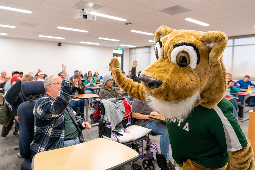 Cougie with students