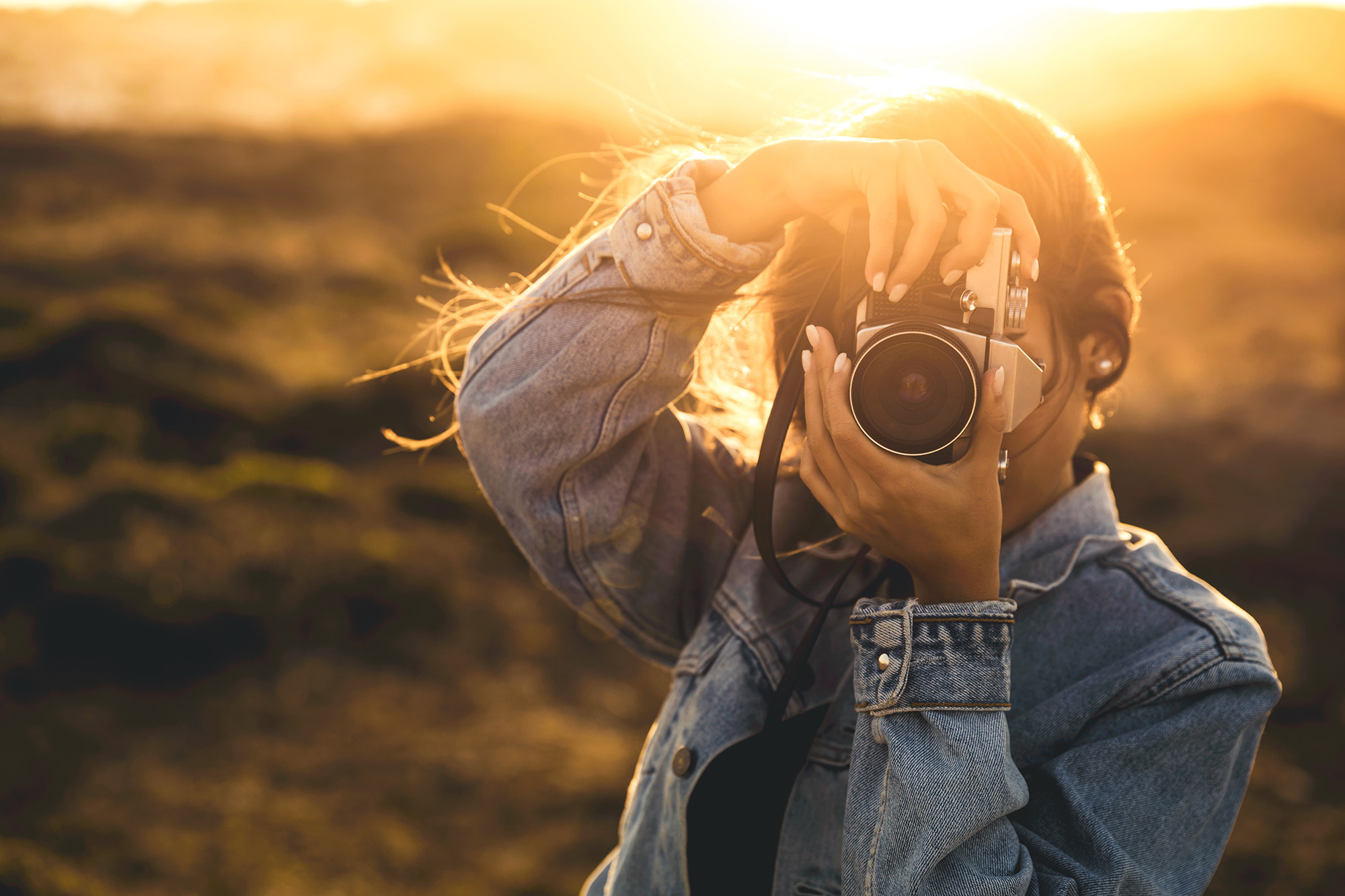 Woman pointing camera at viewer