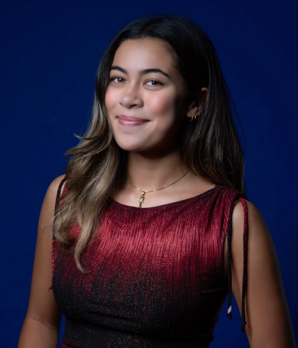 Aneka in a red dress