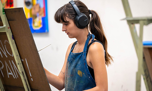 Girl painting on canvas