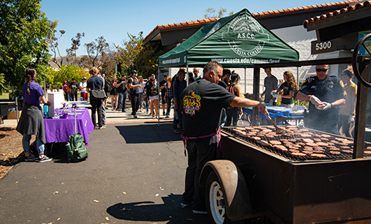 People cooking on a barbecue