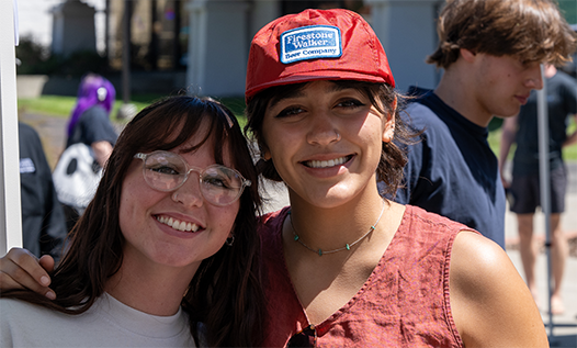 Students smiling at college event